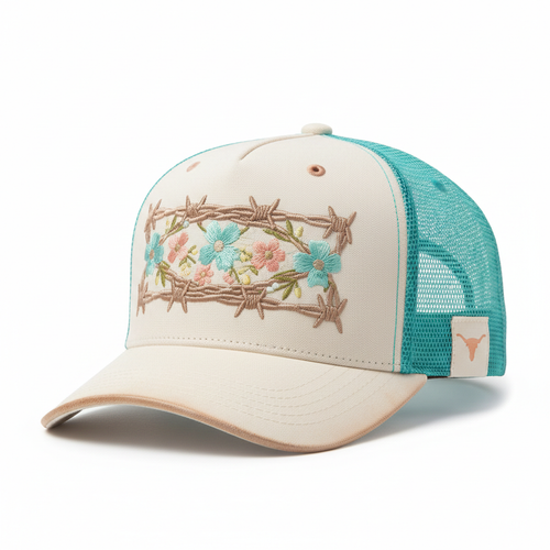 Cream and turquoise snapback with barbed wire and wildflowers embroidered across the front